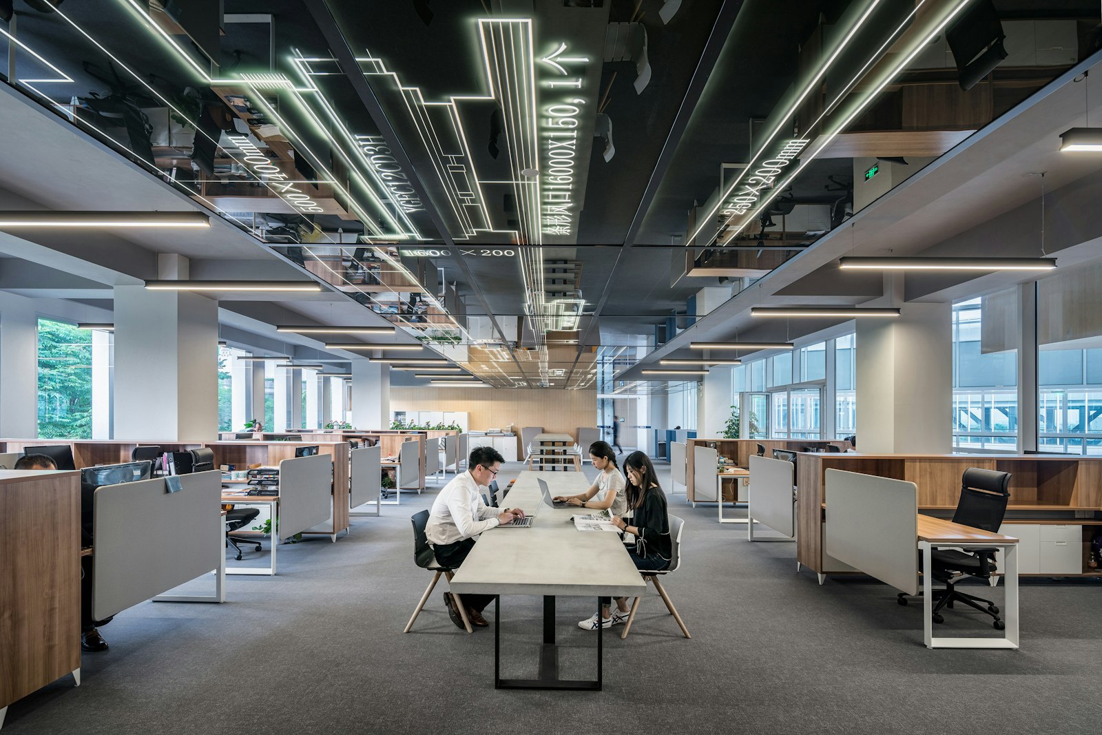 Engineers working in an open-plan office