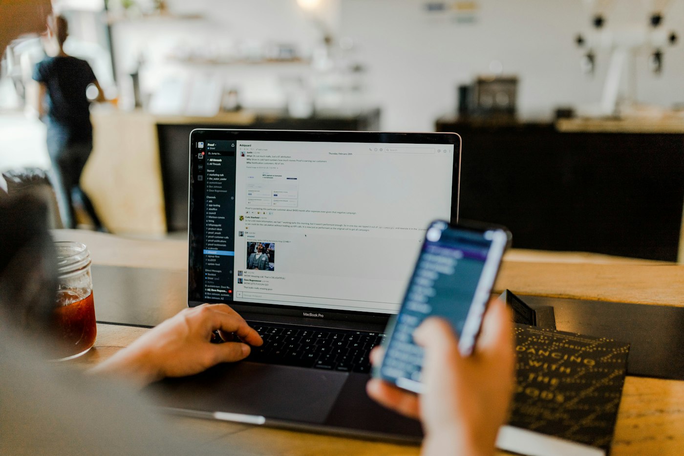 A laptop and phone on a desk