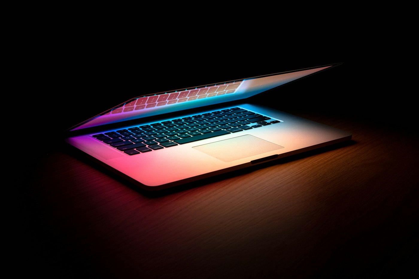 An open laptop in low light